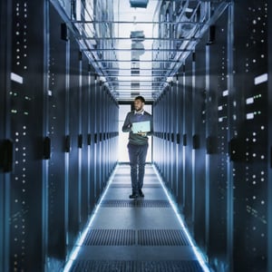 Image of an employee walking in server room