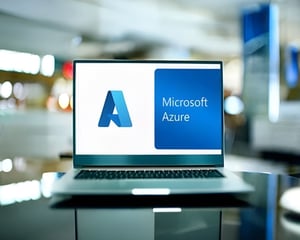 Laptop displaying the Microsoft Azure logo on screen, representing cloud migration, Azure infrastructure, and enterprise cloud solutions in a modern workspace.
