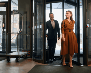 A couple entering a luxury hotel