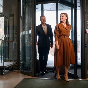 A couple entering a luxury hotel