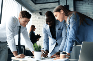 A group of professionals in a modern workplace setting