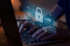 Hands typing on a keyboard with a security lock image, representing cybersecurity