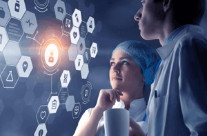 Two healthcare professionals looking at a technology screen