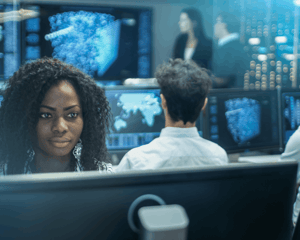Technology professionals working in a security operations center