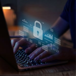 Hands on a keyboard with a security lock